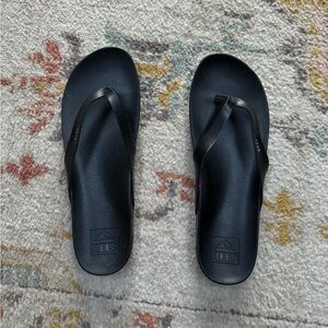 Reef black leather flip flops